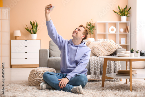Young man with mobile phone...