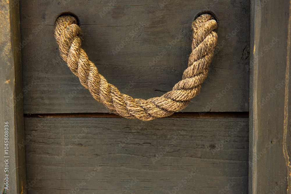 Naklejka premium string hanging on a wooden wall