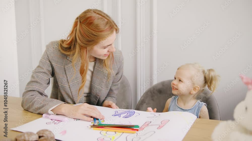 Young Red-Haired Single Business Mom Spends Quality Time with Her Little Daughter as They Color Together with Markers and pencils Young Red-Haired Single Business Mom Spends Quality Time with Her Little Daughter as They Color Together with Markers and pencils