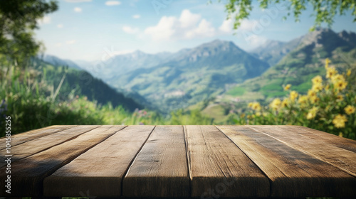 A beautiful, empty wooden table sits in front of a blurry summer scene. Green mountains and a blue sky create a peaceful backdrop. This image is perfect for showcasing products.