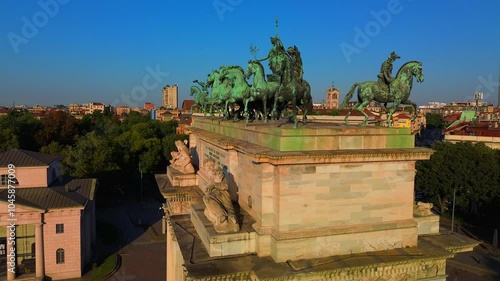 Gate Sempione Porta Sempione city gate to Lombardy in the fall. Arch of Peace. Arco della pace. sunny evening in milan city park aerial panorama city triumphal arch. Sculptures. Italy Milan 11.10.2024 photo