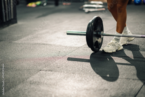 Athlete preparing to lift weights in a gym