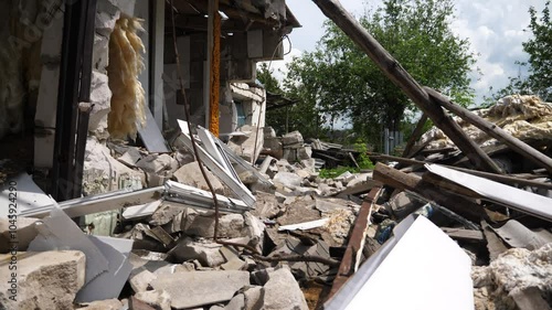 View to destroyed residential buildings at Kharkivska oblast. Ruined houses after bomb attacks on ukrainian territory from russia army. Consequences of russian invasion of Ukraine. Slow motion photo