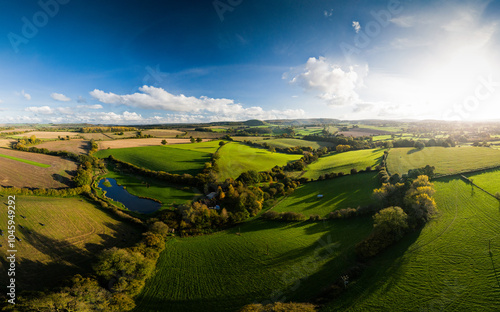 Fototapeta Naklejka Na Ścianę i Meble -  Wide aerial panorama of rural landscape in Wiltshire, UK