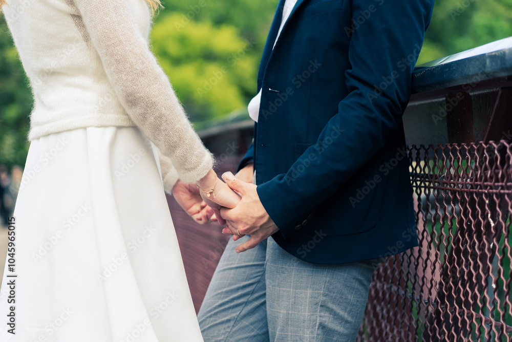 Fototapeta premium bride and groom holding hands