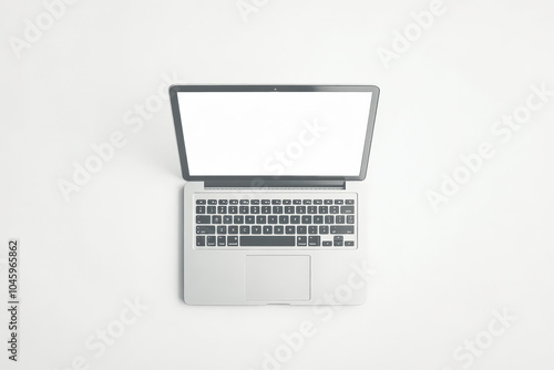 Laptop is open to a blank screen. The laptop is white and silver. The laptop is turned on and ready to use