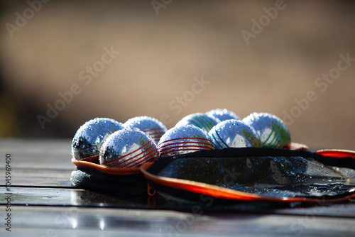 Boules covered in droplets of dew.