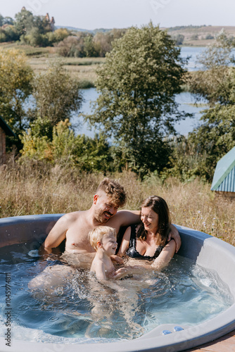 Joyful family moments in an outdoor hot tub, surrounded by nature, creating cherished memories