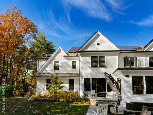 Falling leaves and shorter days cut solar panel production for suburban rooftop system photo