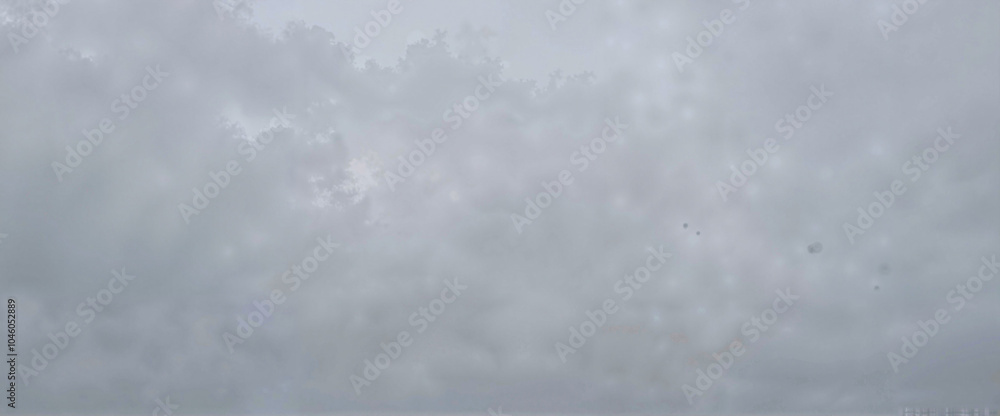 Fototapeta premium Overcast sky with gray clouds and misty atmosphere