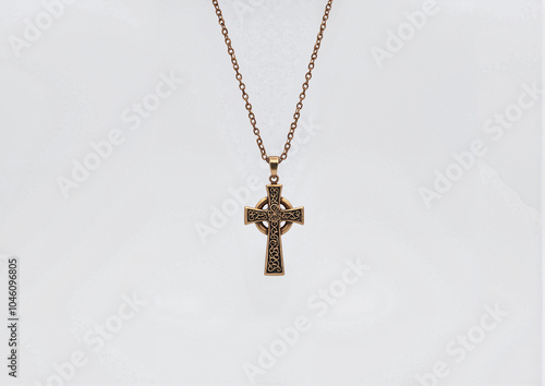 Celtic cross pendant on chain isolated on white background