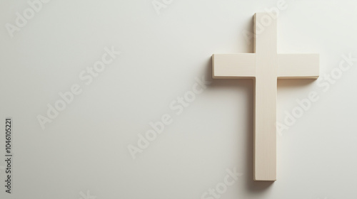 All Saints Day concept,white cross is positioned against a light-colored wall,evoking a sense of calm and representing deep spiritual significance and faith,copy space photo