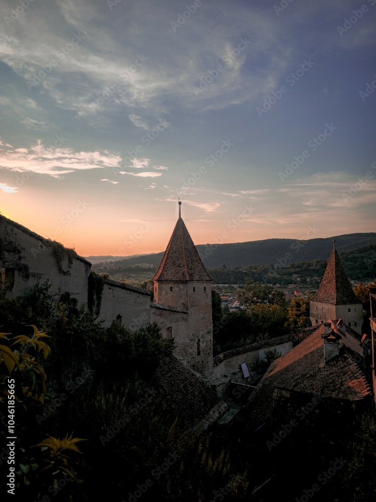 Fototapeta premium Majestic Castle with Towers Bathed in Sunset Glow
