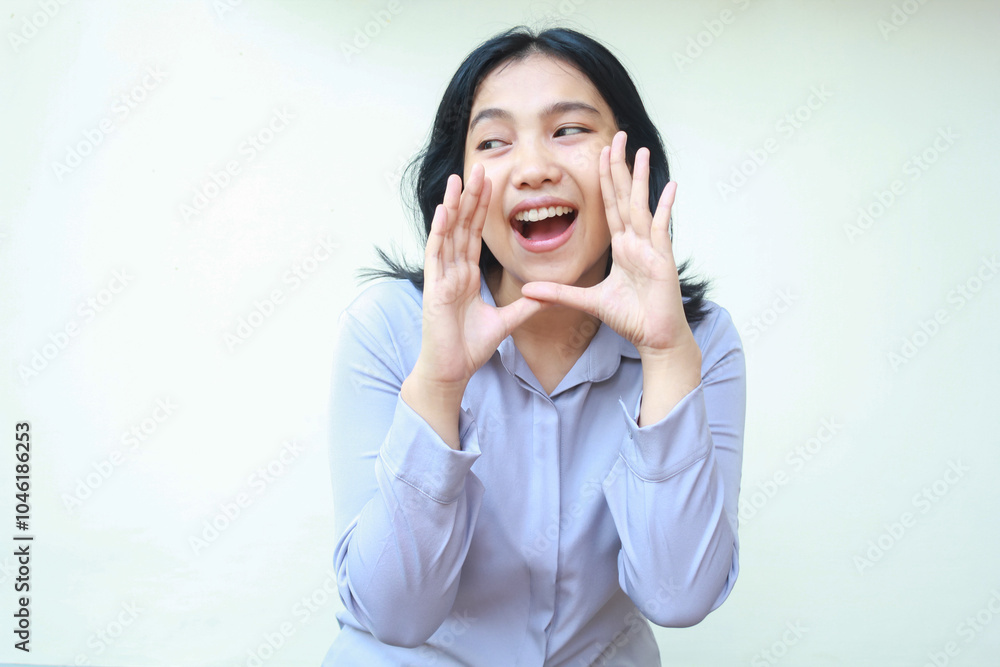 image of pretty asian young business woman screaming to camera with open mouth looking away, promoting product, wear formal purple shirt standing over isolated white background image of pretty asian young business woman screaming to camera with open mouth looking away, promoting product, wear formal purple shirt standing over isolated white background