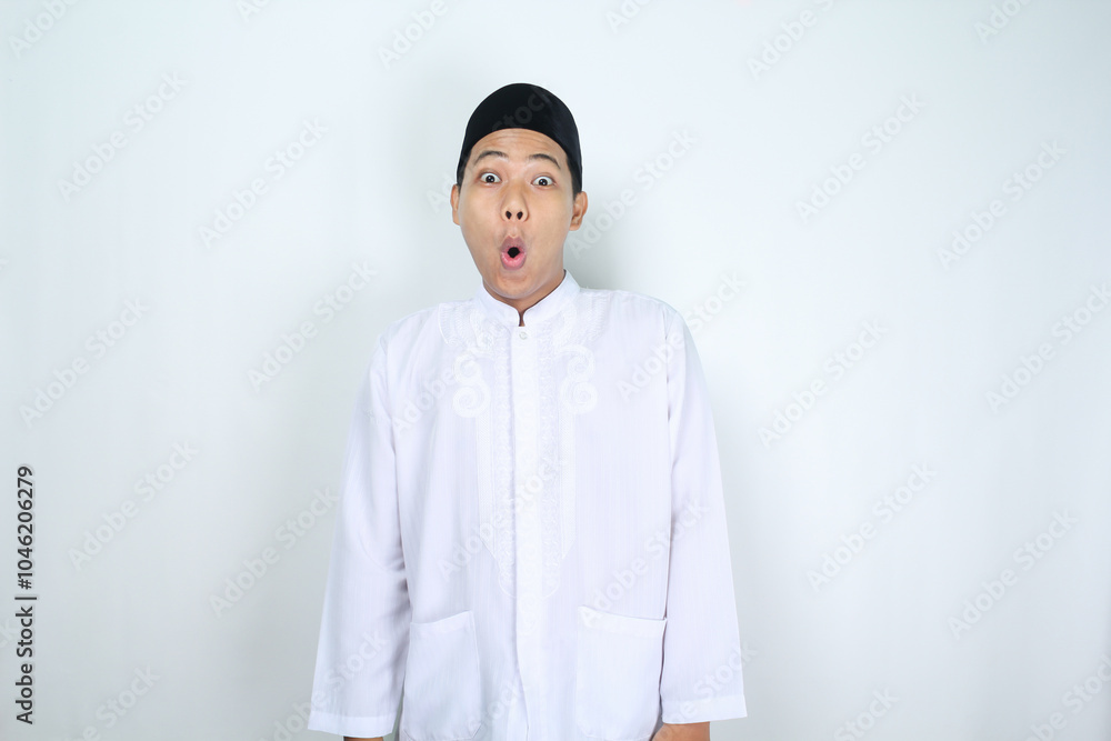 shocked asian man muslim standing on isolated white background