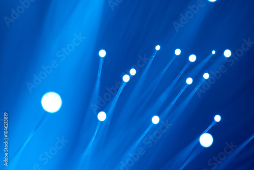 Blue background picture of photoelectricity with the concept of optical fiber optical transmission. photo