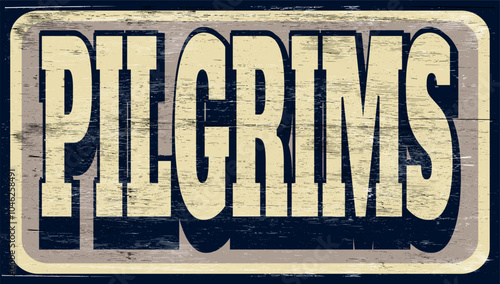 Aged retro pilgrims sign on wood