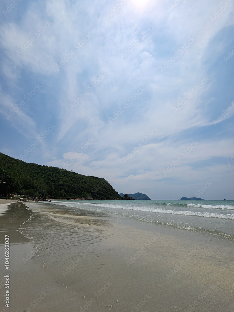 Landscape of the sea with waves crashing on the beach, overlooking the blue sky and mountains in the background. White sand and clear water and beautiful scene of Nam Sai Beach in Sattahip, Chon Buri
Landscape of the sea with waves crashing on the beach, overlooking the blue sky and mountains in the background. White sand and clear water and beautiful scene of Nam Sai Beach in Sattahip, Chon Buri