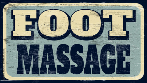 Aged vintage foot massage sign on wood 