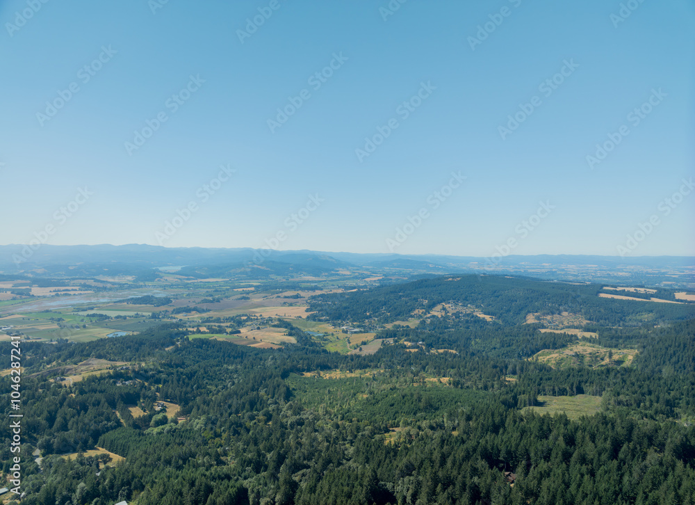 A beautiful blue sky with a few clouds and a mountain range in the background A beautiful blue sky with a few clouds and a mountain range in the background