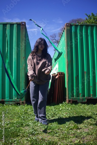 latina girl juggles with flags. Swing flags photo