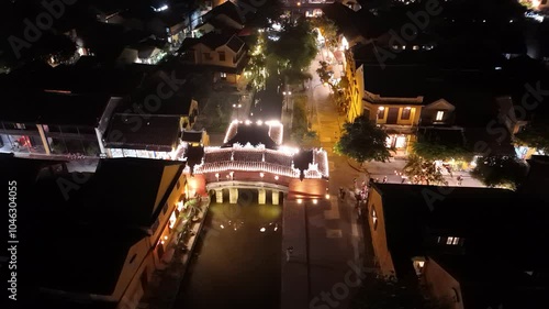 Wallpaper Mural Aerial view of Chua Cau or Japanese Covered ancient Bridge and River in Old city of Hoi An, Vietnam. Vietnamese heritage and culture in Hoian at night Torontodigital.ca