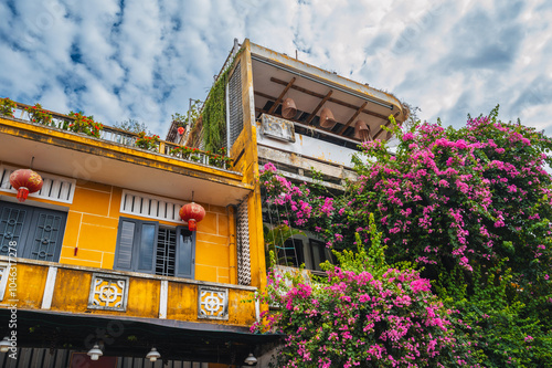 heritage facade of an ancient Asian yellow house in the old town in Hoi An in Vietnam in Asia in summer photo