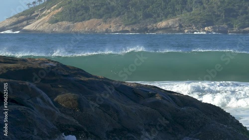 Slow-motion Shot of Crashing Wave and an Island in the Background 2
