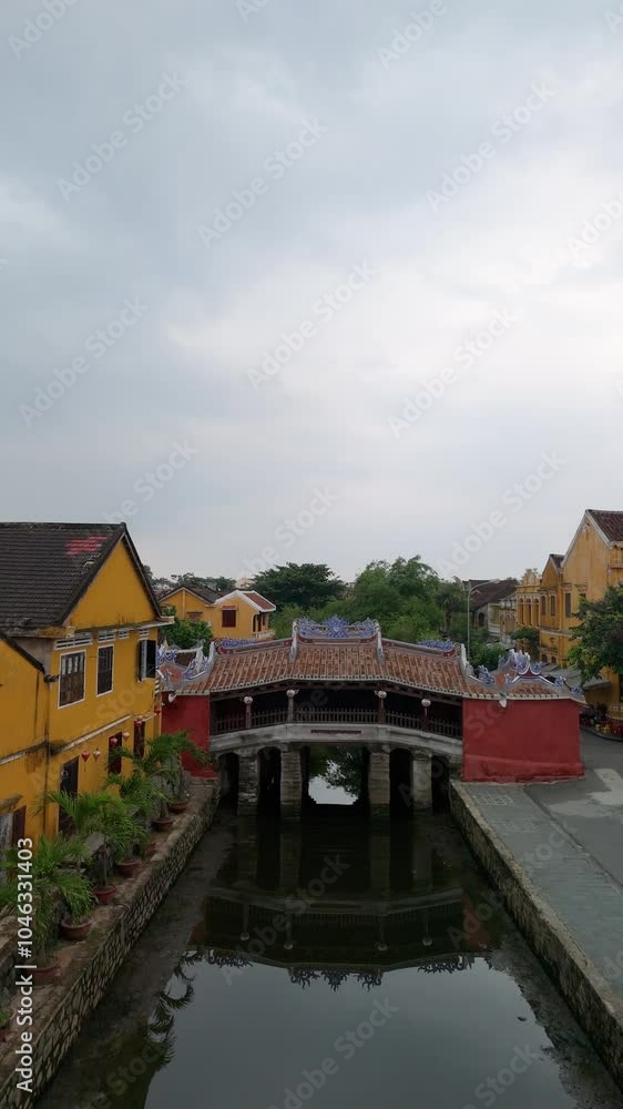 Aerial view of Chua Cau or Japanese Covered ancient Bridge and River in Old city of Hoi An, Vietnam. Vietnamese heritage and culture in Hoian ancient town Aerial view of Chua Cau or Japanese Covered ancient Bridge and River in Old city of Hoi An, Vietnam. Vietnamese heritage and culture in Hoian ancient town