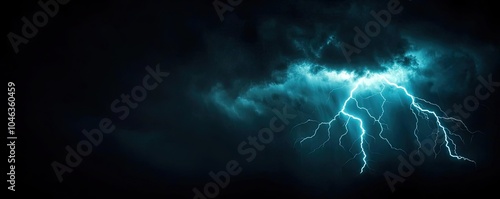 Dramatic storm clouds with lightning illuminating the dark night sky.