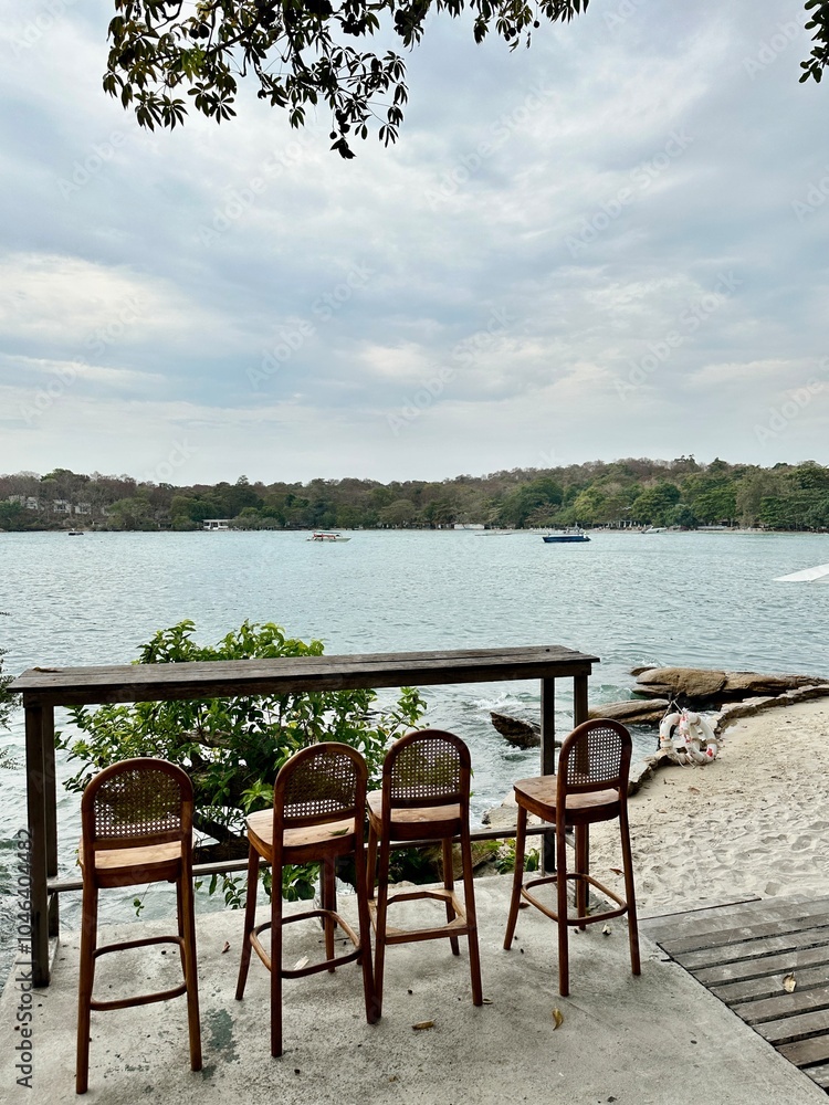 bar table and chairs on the beach with sea view bar table and chairs on the beach with sea view