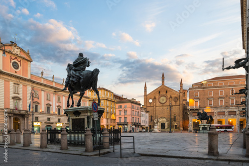 Fototapeta Naklejka Na Ścianę i Meble -  Piacenza city at sunset, Italy. Old town with piazza Cavalli (square horses), Governor's palace on the left and the Basilica of San Francesco d'Assisi. Padan Plain, Emilia Romagna region