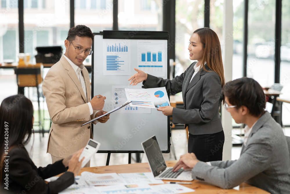 Asian Business Group Chat about graph work Present in meetings, in the office. Asian Business Group Chat about graph work Present in meetings, in the office.