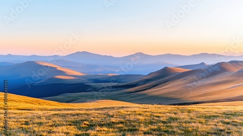 A picturesque landscape showcasing rolling hills and distant mountains under a soft morning light, highlighting nature’s serene beauty.