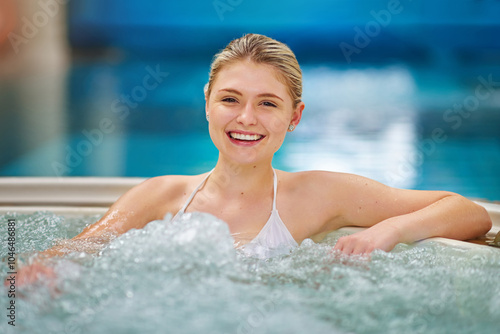 Hot tub, laugh and portrait of woman at spa for hospitality, health benefit and luxury vacation. Summer, peace and water jets with person in pool at hotel resort for wellness, holiday and relaxing