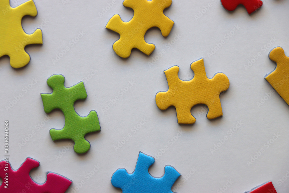 Colorful jigsaw puzzle pieces on white background. Flat lay. Colorful jigsaw puzzle pieces on white background. Flat lay.