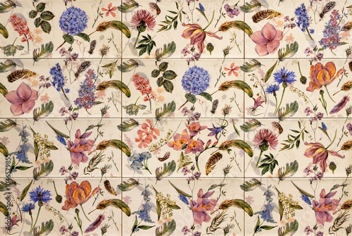 Obraz na płótnie An ornament of various wild flowers on multi-colored ceramic tiles. w salonie
