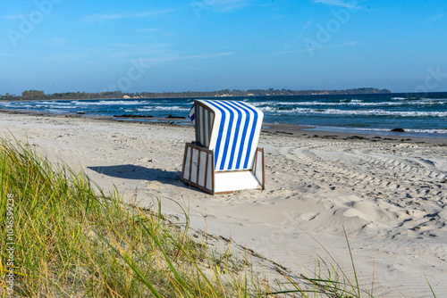 Fototapeta Naklejka Na Ścianę i Meble -  Beach chair with dunes on the island of Rügen on the Baltic Sea