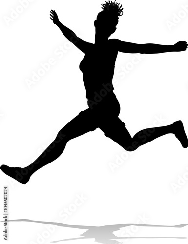 A happy woman jumping for joy in mid air silhouette person concept