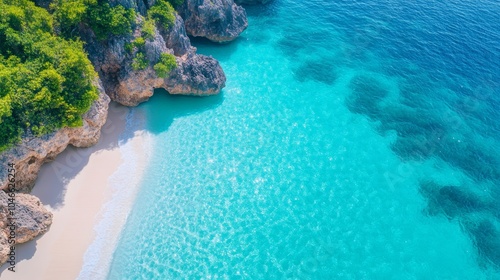 Crystal-clear turquoise waters by rocky coastline photo