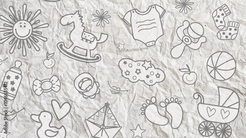 Videophone on crumpled paper with children's toys. Horse, pacifier, cloud, footprints, boat