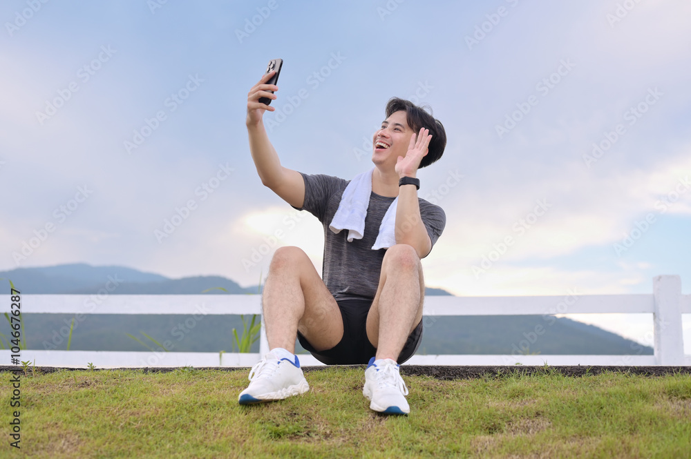 Happy runner taking a selfie with smartphone after successful workout. Fitness and healthy lifestyle concept Happy runner taking a selfie with smartphone after successful workout. Fitness and healthy lifestyle concept