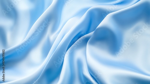 Soft blue satin fabric texture, flowing and draping gracefully, ideal for backgrounds and textiles.