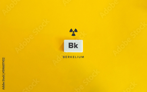 Berkelium (Bk) Banner image. Radioactive Chemical Element. Radioactivity Symbol and Text on Block Letter Tile on Yellow Background.