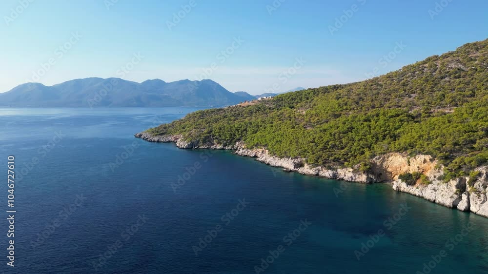 Stunning aerial reveal over beautiful island silhouettes in distance Stunning aerial reveal over beautiful island silhouettes in distance