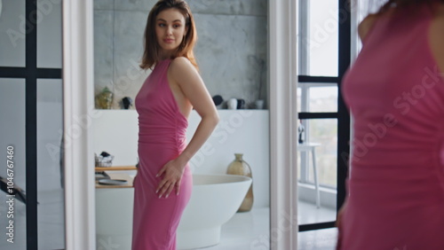 Photos Elegant woman admiring mirror reflection in modern apartment bathroom closeup