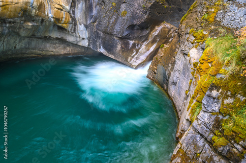 Johnston Canyon turquoise Lower falls splash taken with long exposure at Banff National Park photo