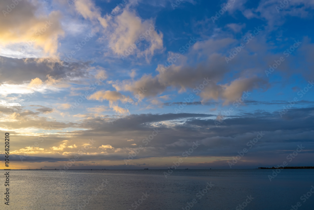 Tranquil Sunset Over the Ocean with Dramatic Cloudscape Tranquil Sunset Over the Ocean with Dramatic Cloudscape