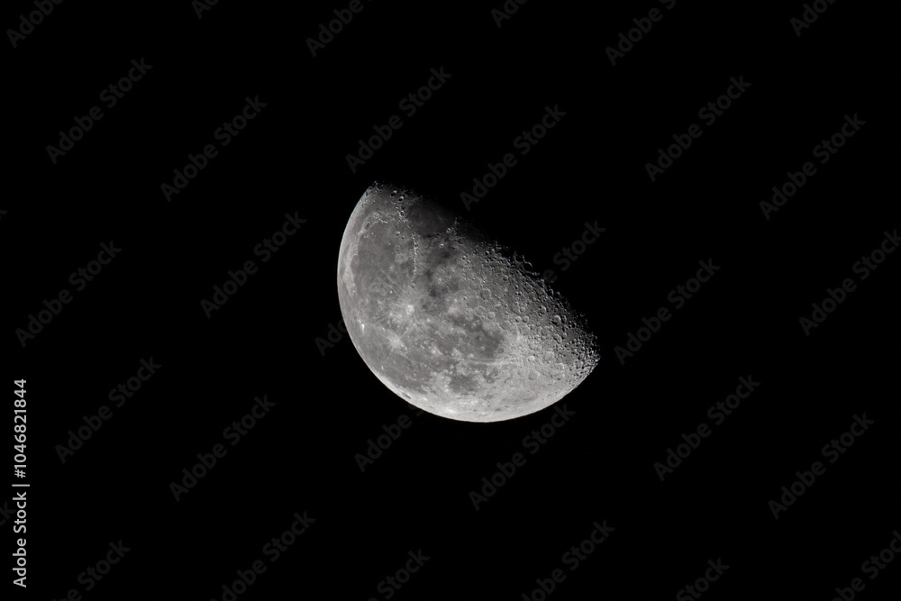 Detailed closeup of The Moon in waning gibbous phase in the night sky. The Moon against black background with copy space Detailed closeup of The Moon in waning gibbous phase in the night sky. The Moon against black background with copy space