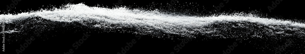 A wave-like formation of white powder against a black background. Black and white background images - A wave-like formation of white powder against a black background. Black and white background images -